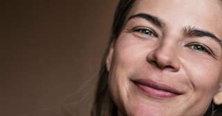 Portrait of young woman before skin retouching.